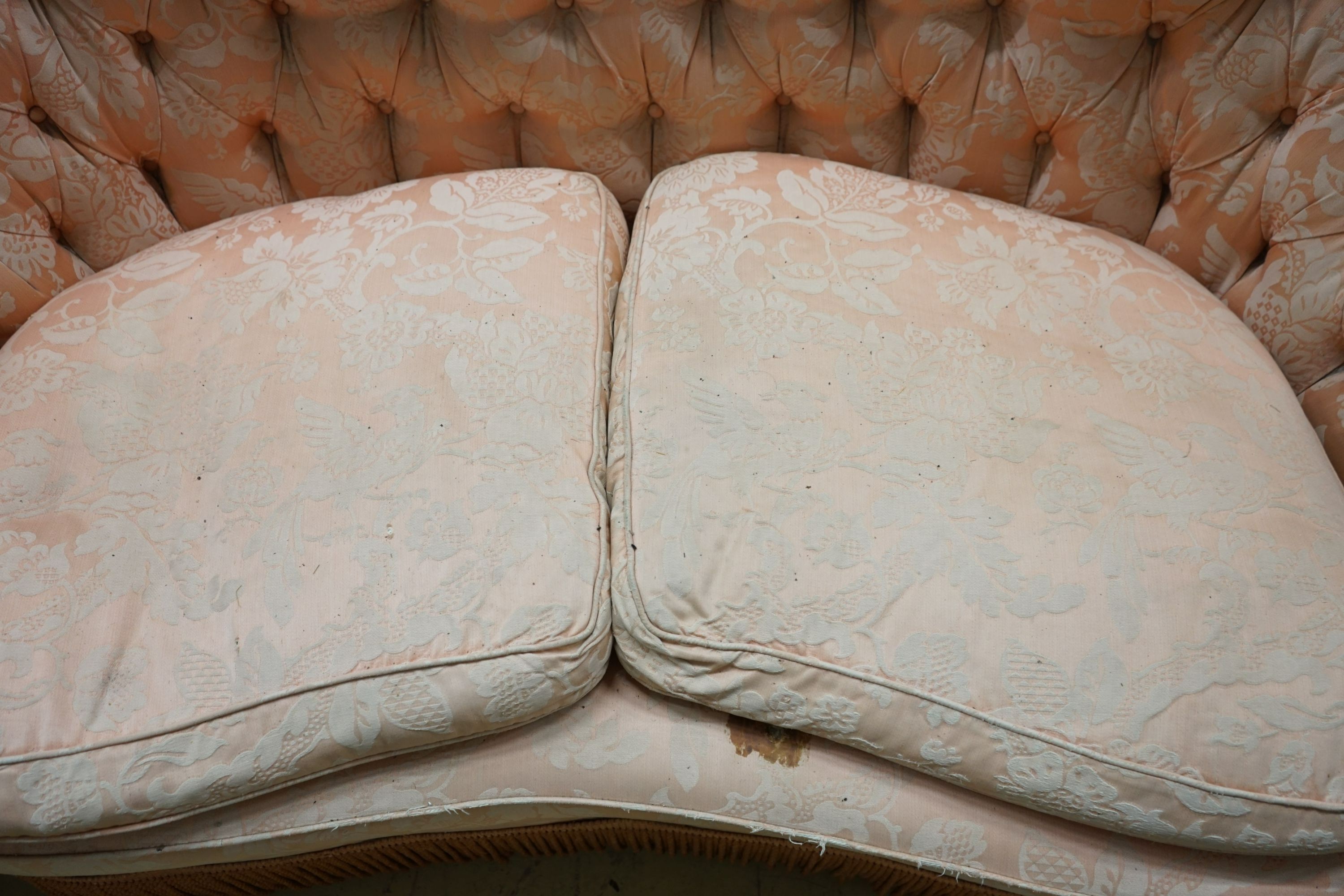 A mid century tub frame settee upholstered in buttoned pink damask, length 160cm, depth 76cm, height 76cm